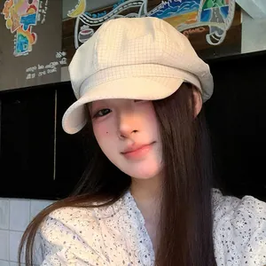 Vintage beige grid newsboy hat worn by model in a stylish Korean retro painter hat style