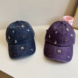 Retro washed cotton baseball caps with small garden embroidery, unisex vintage style.