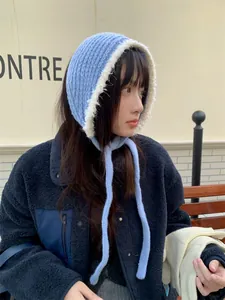 Close-up of a blue Korean style knitted plush hooded earwarmer with long ties