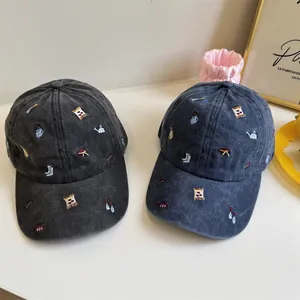 Vintage washed cotton baseball caps with colorful embroidered garden themed icons