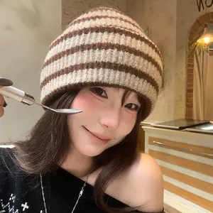 Vintage brown striped knit beanie for women, cozy winter thermal hat worn by model