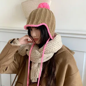 Stylish Korean contrast color knitted winter hat with pink pom-pom and earflaps
