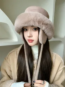 Detail shot of woman wearing a warm plush bucket hat with ear flaps for winter