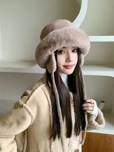 Plush winter bucket hat with ear flaps shown on an Asian model for warm thermal protection