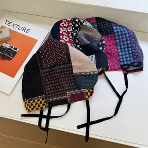 Vintage colorful patchwork bandana hat with adjustable straps for a stylish retro look