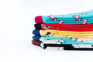 Stacked colorful cotton socks with cute farm animal patterns and contrasting toe details.