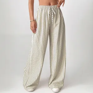 High-waisted striped wide-leg pants with elastic drawstring waist and vertical patterns
