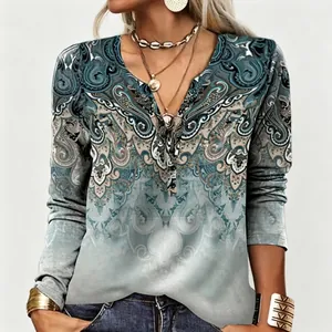 Detail of women's casual long-sleeve top featuring vintage ethnic paisley print and V-neck