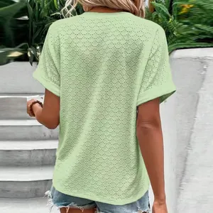 Back view of light green women's T-shirt featuring delicate eyelet embroidery texture