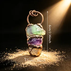 Macro detail of vintage bronze pendant with raw amethyst and fluorite, size 6cm x 3.5cm
