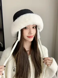 Close-up of women's plush winter fisherman hat featuring ear flaps and thick faux fur