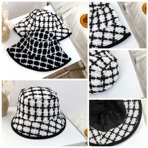 Detailed macro views of retro black and white checkered tweed bucket hats for women