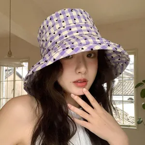 Fashionable purple gingham bucket hat with black heart pattern and wide sun protection brim