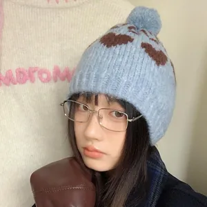 Vintage light blue heart pattern knit beanie with pom-pom for winter warmth and style