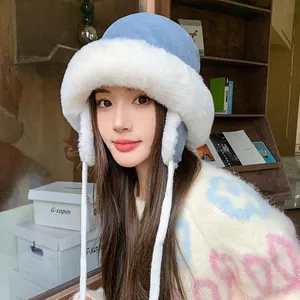 Cozy light blue and white plush trapper hat for women with warm ear flaps and knit ties