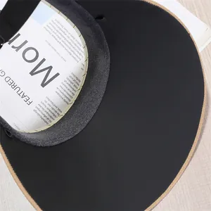 Dettaglio della fodera nera anti-UV su un cappello a visiera in paglia