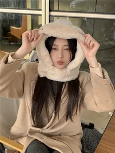 Cozy beige faux fur lined winter hood with suede shell providing warm ear and neck protection
