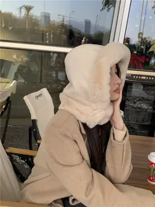 Detailed side view of plush cream earflap hat featuring soft faux fur trim and suede finish