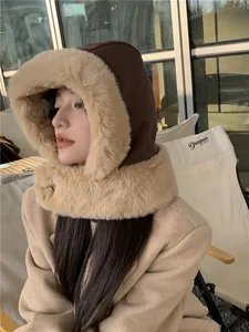 Cozy plush winter hood hat with faux fur trim worn by a model in outdoor setting