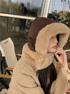Close-up of warm winter aviator hat with thick beige faux fur lining and suede finish.