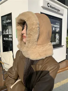 Close-up view showing the soft plush faux fur lining and warm suede exterior of the winter hood.