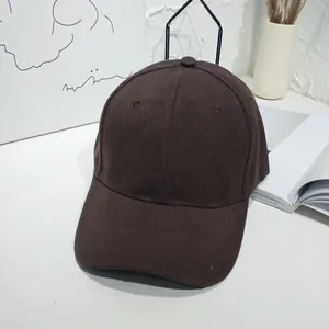 Detailed view of dark brown cotton canvas baseball cap with curved brim
