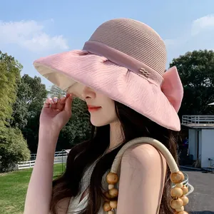 Elegant Hepburn style pink organza bow straw hat with wide brim for summer sun protection