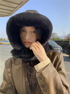 Close-up of a black plush hooded hat with an integrated neck warmer for winter use
