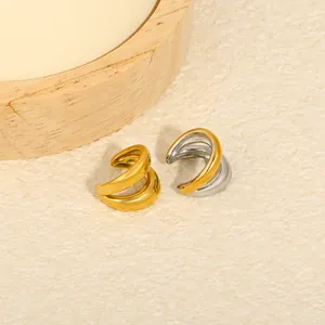 Detailed view of stylish gold and silver layered C-shaped ear cuffs for non-pierced ears.