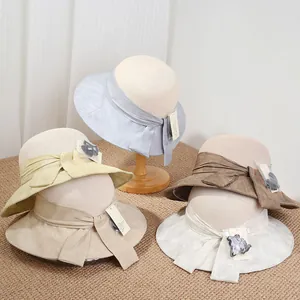 Chapeaux de soleil en paille à large bord pour femmes avec rubans à nœuds élégants