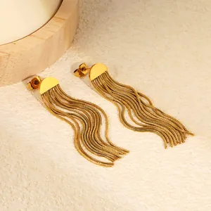 Detailed macro view of gold-plated stainless steel tassel earrings with chain fringe.