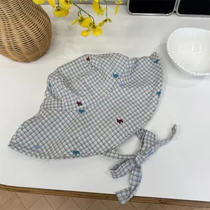 Fresh plaid sun hat for women featuring a wide brim and cute bow tie detail for summer beach