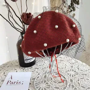 Red wool beret with pearls and mesh veil detail for vintage look