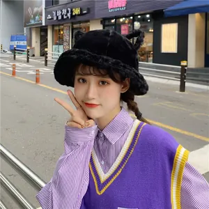Sweet black plush bucket hat with cute cat ears for autumn and winter fashion.