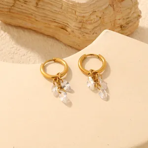 Close-up detailed view of elegant gold hoop earrings with marquise-cut zirconia charms