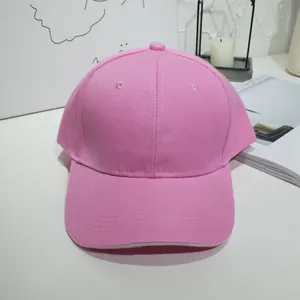 Close-up detail of a stylish pink solid color baseball cap designed for summer sun protection