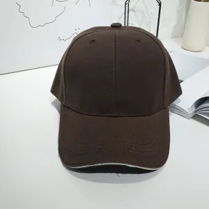 Minimalist solid brown cotton baseball cap detail for trendy street style casual outfits
