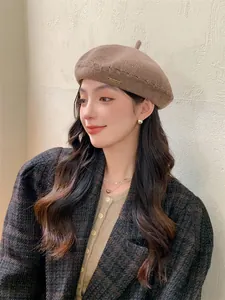 Stylish brown knitted beret hat for women, breathable summer painter cap model wearing view