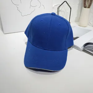 Detailed view of a royal blue minimalist baseball cap with high-quality fabric texture