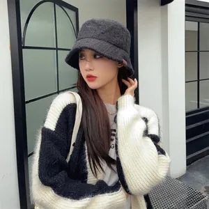 Close-up detail of a warm fuzzy bucket hat in Maillard style for women's winter fashion
