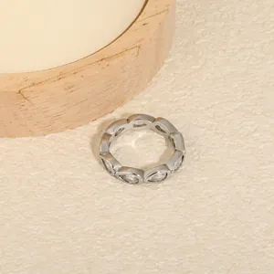 Detailed view of teardrop-shaped white zircon stones on a silver stainless steel band