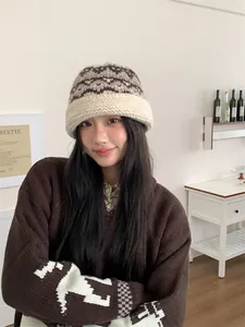 Detailed view of a cozy wool-blend knit bucket hat with vintage ethnic patterns for women