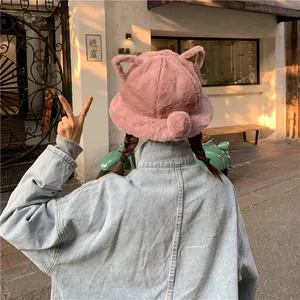 Back view of a cute pink plush cat-ear bucket hat for winter street style fashion