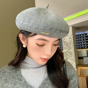 Stylish grey knitted beret for women, breathable woven painter hat perfect for autumn.