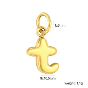 Close-up of gold stainless steel lowercase letter t pendant with dimension markings.