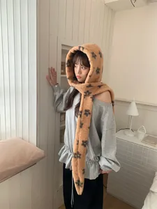 Cozy brown plush hooded scarf for women with dark floral pattern for winter warmth