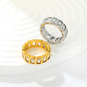 Macro detail of luxury gold and silver stainless steel rings with baguette zircons