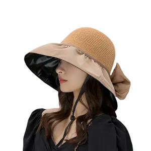 Elegant summer sun hat with wide brim, bow detail, and UV-protective vinyl lining.