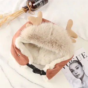 Close-up of brown reindeer antler trapper hat with soft faux fur lining and buckle