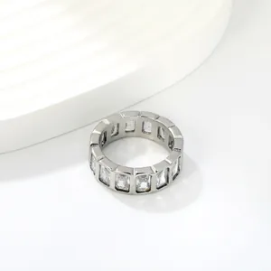Macro detail of stainless steel eternity ring with rectangular cubic zirconia stones